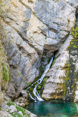 Savica Waterfall in steep walls of Kamarca near Bohinj in Triglav National Park in Slovenia during summertime
