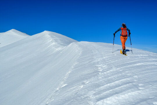 Woman backcountry skiing on Monte Mileto in Maiella National Park, Italy