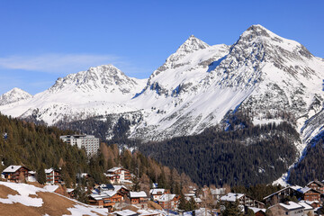 famous village Arosa in the swiss mountains in winter