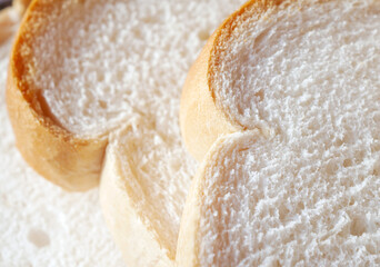 Close-up of freshly sliced ​​soft and fragrant bread with white bread,brown bread crust macro