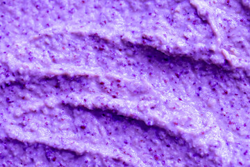 Lilac berry yogurt ice cream with blueberries, blackberries and bilberries. Fresh fruit and berry smoothie. Ice cream texture. Delicious sweet dessert close-up as background.