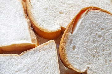 Close-up of freshly sliced ​​soft and fragrant bread with white bread,brown bread crust macro