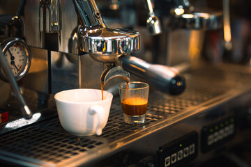 Brewing espresso in to glass cups silver coffee espresso machine