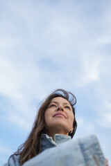 Low-Angle Portrait of a Woman Looking Up at the Sky