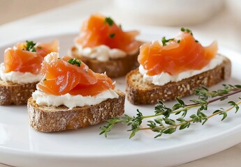 Sad, some outcomes, smooth creamy mousse on bruschetta with salmon slices and cream cheese, white plate, food