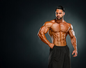 Fototapeta premium muscular young man posing in studio