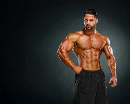 muscular young man posing in studio