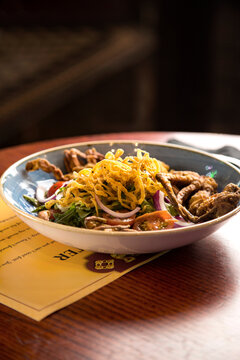 A bowl of soft shell crab salad at a restaurant