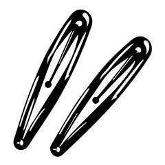 Two stylized black and white hair clips placed against a white backdrop