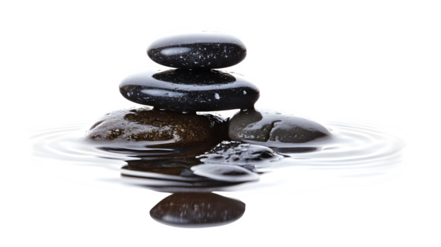 stack of smooth black stones balanced on each other, zen concept, reflection on white surface