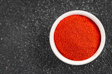 Ground hot red pepper cayenne pepper paprika spice appetizer vegetables dish organic product fresh tasty gourmet food background on the table rustic food top view copy space