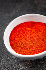 Ground hot red pepper cayenne pepper paprika spice appetizer vegetables dish organic product fresh tasty gourmet food background on the table rustic food top view copy space