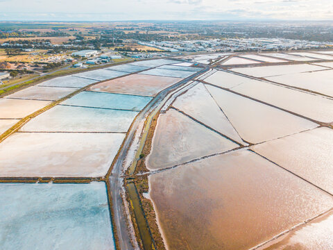 Aerial view of salt evaporation ponds of various shapes
