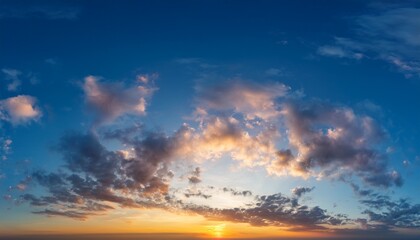 Fototapeta premium sunset panorama of blue sky and orange clouds