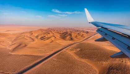 aerial view of an airplane flying over the desert
