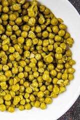 Green peas canned appetizer vegetables dish organic product fresh tasty gourmet food background on the table rustic food top view copy space keto and paleo diet vegetarian and vegan food