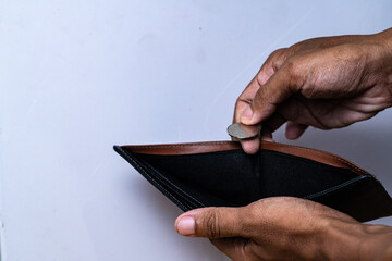 Empty wallet reveals single coin