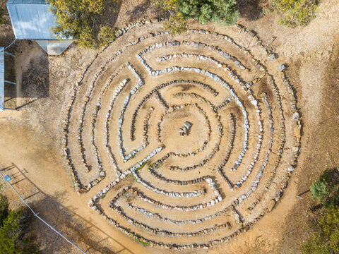 Aerial view of a stone maze laid out on the ground