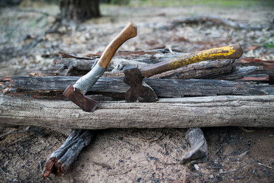 Two axes in wood pile