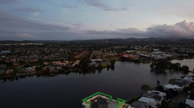 Evening View Of Lake Orr With Waterfront Apartments In Varsity Lakes - Suburb In Gold Coast, Queensland. wide drone shot
