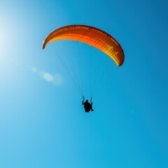 Peaceful Paraglider Silhouette Against Vibrant Blue Sky