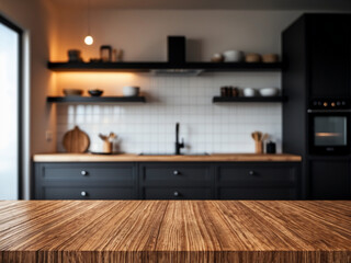 Fototapeta premium Blurred modern kitchen with black cabinets and a textured wooden table in the foreground.