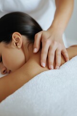 Fototapeta premium Woman enjoying a relaxing shoulder massage in a serene spa setting, embodying tranquility and well-being.