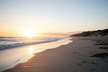 Sea Waves Touching Sandy Beach at Sunset with Dunes Landscape along Shoreline