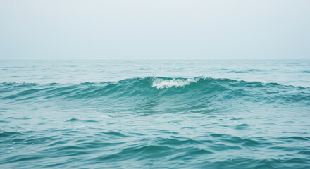 Obraz premium Background of ocean waves rolling on a calm sea