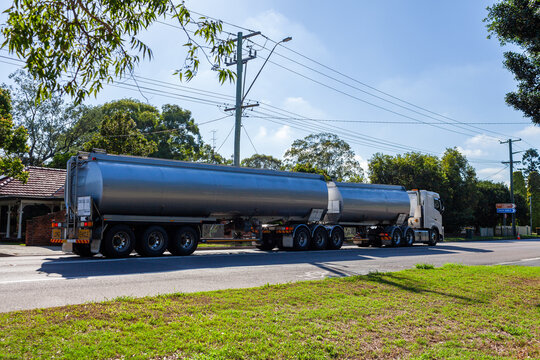 Tanker truck traveling on highway through country town of Singleton
