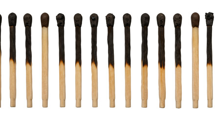 Burnt matches line against black background