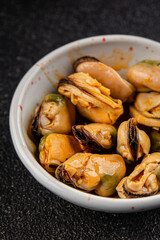 Mussels seafood canned appetizer dish organic fresh tasty gourmet food background on the table rustic food top view copy space