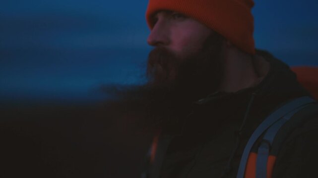 Man Standing on Cliff Overlooking Vast Icelandic Landscape