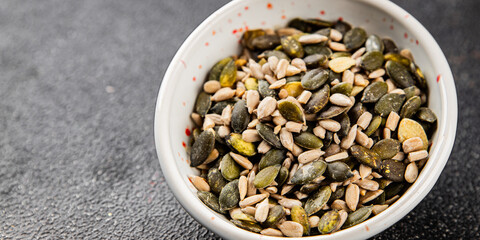 Seed mix bio pumpkin seeds, sunflower seeds superfood natural food dish organic fresh tasty gourmet food background on the table rustic food top view copy space