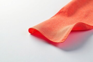 Single, brightly lit flap of fabric isolated on white background , minimal, piece, material