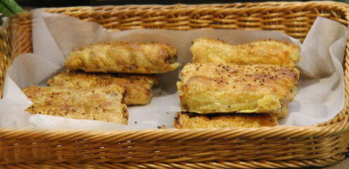 Display of Freshly Baked High Quality Meat Sausage Rolls.