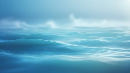 Fototapeta premium Ocean Waves Flowing Smoothly with Soft Blue Tones and Hazy Sky