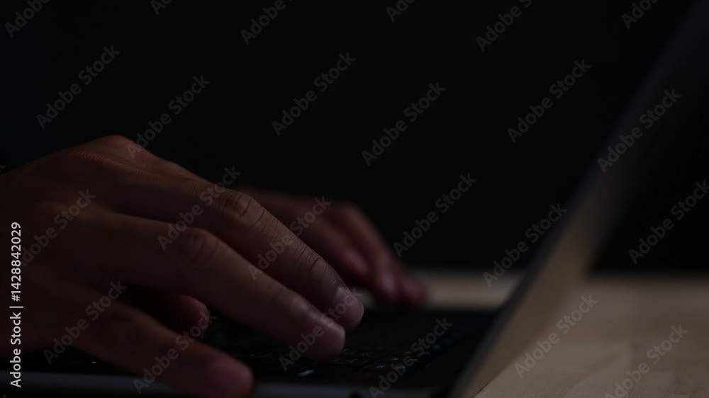 Poster man hand typing on computer laptop in dark or low light