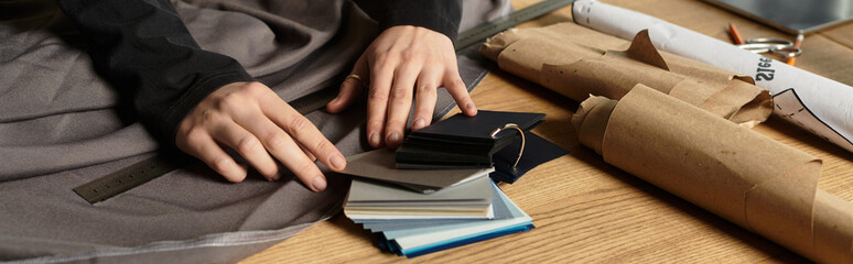 Creative young woman engages in DIY crafts with various materials and tools at home workspace