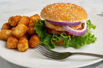 salmon burger with  ltater tots,