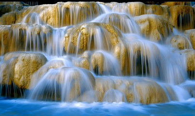 Serene Cascading Waterfall in Golden Hues