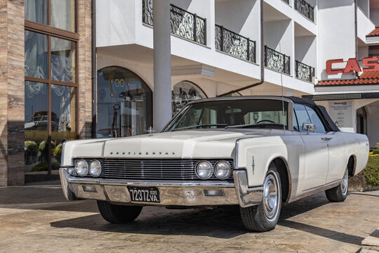 Marina Dinevi, Sveti Vlas, Burgas, Bulgaria - 04.21.2025. Luxury white 1963 Lincoln Continental Sedan awaiting in front of a hotel on yacht marina in Sveti Vlas, Burgas, Bulgaria