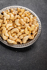 Cashew nuts superfood natural food dish organic fresh tasty gourmet food background on the table rustic food top view copy space