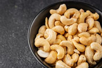 Cashew nuts superfood natural food dish organic fresh tasty gourmet food background on the table rustic food top view copy space