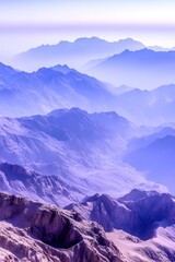 Fototapeta premium Misty purple mountain range at sunrise, aerial view
