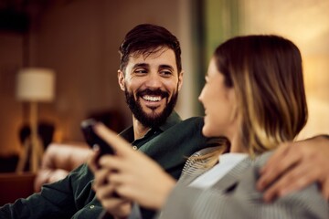 Couple Enjoying a Relaxing Moment Together on a Cozy Couch at Home