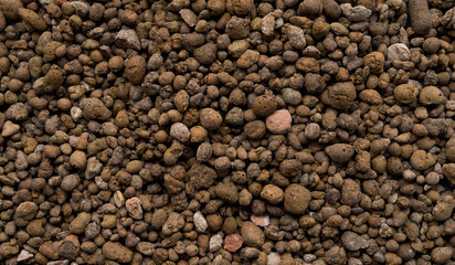 Clay pebbles for plants, leca clay pebbles for gardening texture background, top view