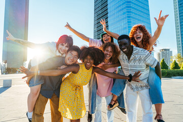 Naklejka premium Multiethnic group of young friends meeting and having fun outdoors - Multiracial happy and stylish teen students bonding in the city, concepts about youth, teenagers lifestyle and diversity