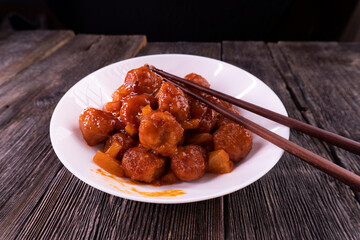 Baked Sweet and Sour Meatballs. Pineapple. Chopsticks