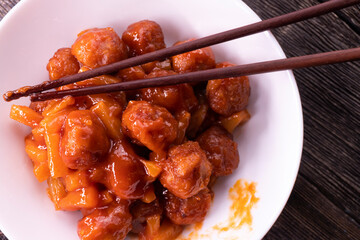 Baked Sweet and Sour Meatballs. Pineapple. Chopsticks
